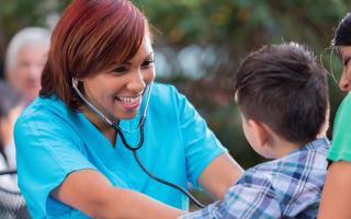 a nurse is doing health check on a boy